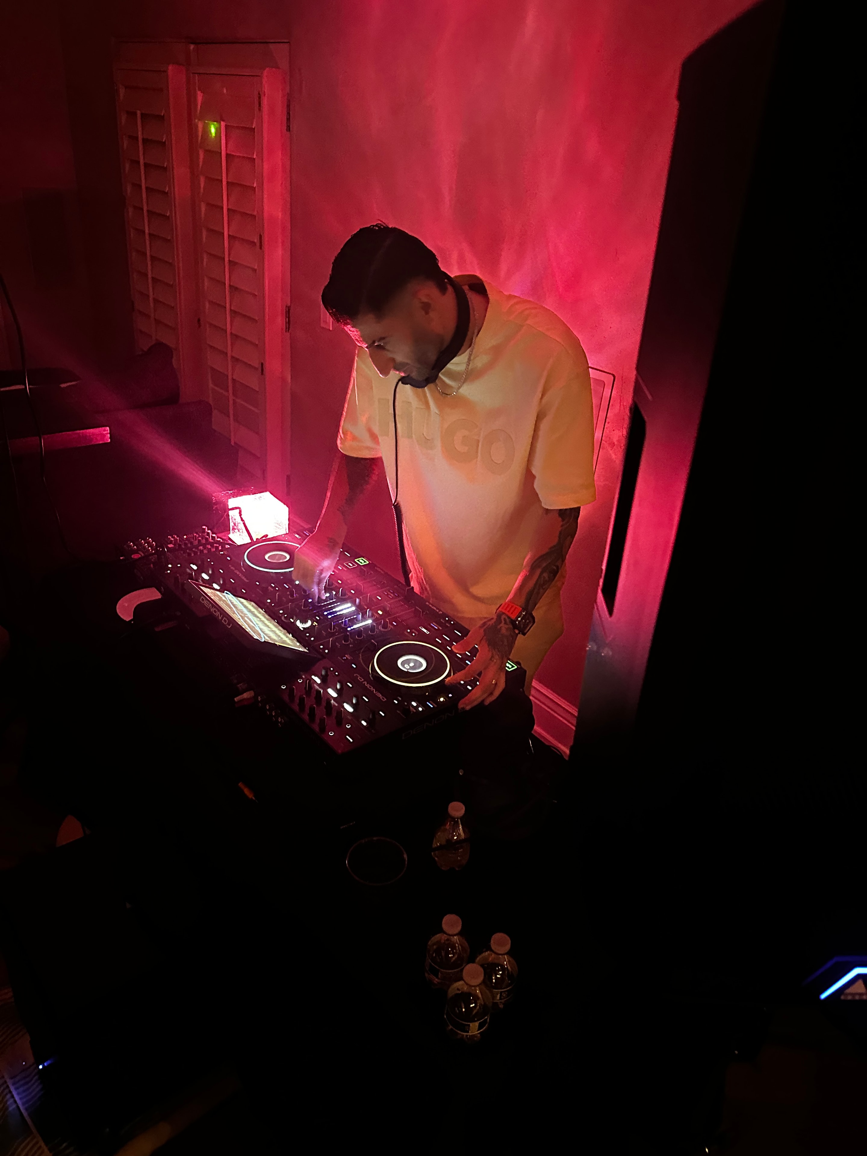 E_YAD performing live with pink neon lighting